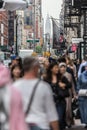 New York, NY, USA - May 17, 2018: Crowds of people walking sidewalk of Broadway avenue in Soho of Midtown Manhattan on