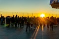 Tourists enjoying the sunset from the observation deck, the