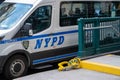 NYPD New York Police Department van and car boot by subway antrance