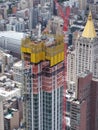 New York, NY, USA. New skyscrapers under construction. Construction site with cranes, elevators and scaffolding Royalty Free Stock Photo