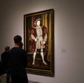 Visitors to the Met`s Tudor Gallery admire a full length portrait of King Henry VIII