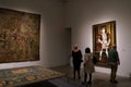 Visitors to the Met`s Tudor Gallery admire a full length portrait of King Henry VIII