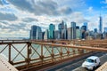 NEW YORK, OCT,25, 2013: View on famous NYC Brooklyn Bridge gate and running cars with tourists. Famous New York architecture bridg Royalty Free Stock Photo