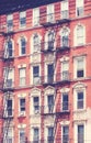 New York old building with fire escape, color toning applied, USA