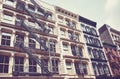 New York old building with iron fire escapes, color toning applied, USA Royalty Free Stock Photo