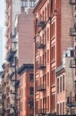 New York old buildings with fire escapes, color toning applied, USA Royalty Free Stock Photo