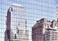 New York old buildings reflected in windows of a modern skyscraper Royalty Free Stock Photo