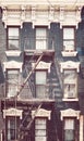 New York old townhouse with fire escape, color toning applied, USA