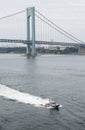 New York Police Boat Cruising Under Verrazano Bridge Royalty Free Stock Photo