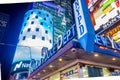 New York Police Department Futuristic Building in Times Square. Bright Blue Lights and Billboards