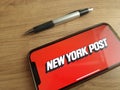 New York Post logo displayed on mobile phone