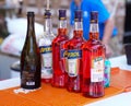 Bottles of Aperol Aperitivo and bottle of Prosecco are main ingredients for popular Aperol Spritz cocktail on the bar table top