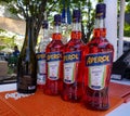 Bottles of Aperol Aperitivo and bottle of Prosecco are main ingredients for popular Aperol Spritz cocktail on the bar table top