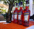 Bottles of Aperol Aperitivo and bottle of Prosecco are main ingredients for popular Aperol Spritz cocktail on the bar table top