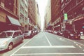 NEW YORK - SEPTEMBER 2, 2018: New York City street road in Manhattan at summer time, many cars, yellow taxis and busy people walk Royalty Free Stock Photo