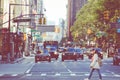 NEW YORK - SEPTEMBER 2, 2018: New York City street road in Manhattan at summer time, many cars, yellow taxis and busy people walk Royalty Free Stock Photo