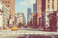 NEW YORK - SEPTEMBER 2, 2018: New York City street road in Manhattan at summer time, many cars, yellow taxis and busy people walk Royalty Free Stock Photo