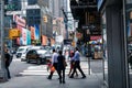 NEW YORK - SEPTEMBER 2, 2018: New York City street road in Manhattan at summer time, many cars, yellow taxis and busy people walk Royalty Free Stock Photo