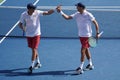Grand Slam champions Mike and Bob Bryan of United states in action during US Open 2017 round 3 men`s doubles match Royalty Free Stock Photo