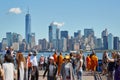 People and tourists shooting photos and New York city skyline