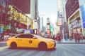 NEW YORK - SEPTEMBER 2, 2018: Yellow cab speeds through Times Sq Royalty Free Stock Photo
