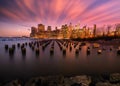 New york skyline seen from the bay with moon and sticks on the water and skyscrapers on the background Royalty Free Stock Photo