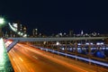 New York skyline, traffic at the Brooklyn Bridge at night, Manhattan buildings and skyscrapers Royalty Free Stock Photo