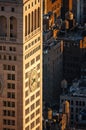 New York skyscraper at sunset with rooftop wooden water tanks