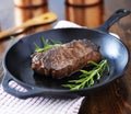 New york strip steak cooked in iron skillet Royalty Free Stock Photo