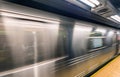 New York subway train fast moving in station Royalty Free Stock Photo