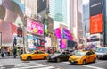 New York, Times Square. Scyscrapers, colorful neon lights, ads, cars and people Royalty Free Stock Photo