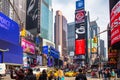 New York, Times Square. Scyscrapers, colorful neon lights, ads, cars and people Royalty Free Stock Photo