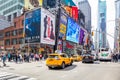 New York, Times Square. Scyscrapers, colorful neon lights, ads, cars and people Royalty Free Stock Photo