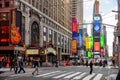 New York, Times Square. Scyscrapers, colorful neon lights, ads, cars and people Royalty Free Stock Photo