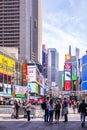 New York, Times Square. Scyscrapers, colorful neon lights, ads and people Royalty Free Stock Photo