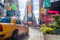 New York Times Square View Behind a Yellow Cab. Beautiful District Full of LED Screens, Billboards and Advertisements Royalty Free Stock Photo
