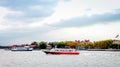 New York Tourist Water Tour Boats passing by Ellis Island.