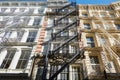 New York typical building facades with fire escape stairs Royalty Free Stock Photo