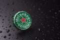 New York, UNITED STATES OF AMERICA - February 20, 2020: classic cap close-up of Heineken on a black background with drops of water