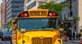 Yellow classic public school bus on the street, New York, Manhattan downtown Royalty Free Stock Photo