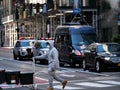 New York, United States, USA March 26, 2020: african american man with mask in front of police escort during coronavirus