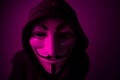 New York, USA - 22 april 2021: man wearing vendetta mask with hoodie on black background. This mask is symbol for Anonymous