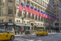 Many flags on the facade of The Saks Fifth Avenue department store in Midtown Manhattan in New York,USA Royalty Free Stock Photo