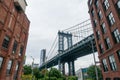 Pillar of Manhattan Bridge from alley in Dumbo district in Brooklyn Royalty Free Stock Photo