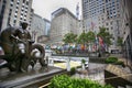 New York, USA Ã¢â¬â August 23, 2018: Rockefeller Center, flagpoles with flags of united nations member countries and pedestrian Royalty Free Stock Photo