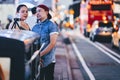 New York, USA - August 3, 2018: Young couple smiling and taking selfie in Time Square