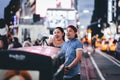 New York, USA - August 3, 2018: Young couple smiling and taking selfie in Time Square