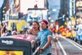 New York, USA - August 3, 2018: Young couple smiling and taking selfie in Time Square