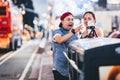 New York, USA - August 3, 2018: Young couple smiling and taking selfie in Time Square