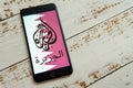 Black iPhone with logo of news media Al Jazeera on the screen. Royalty Free Stock Photo